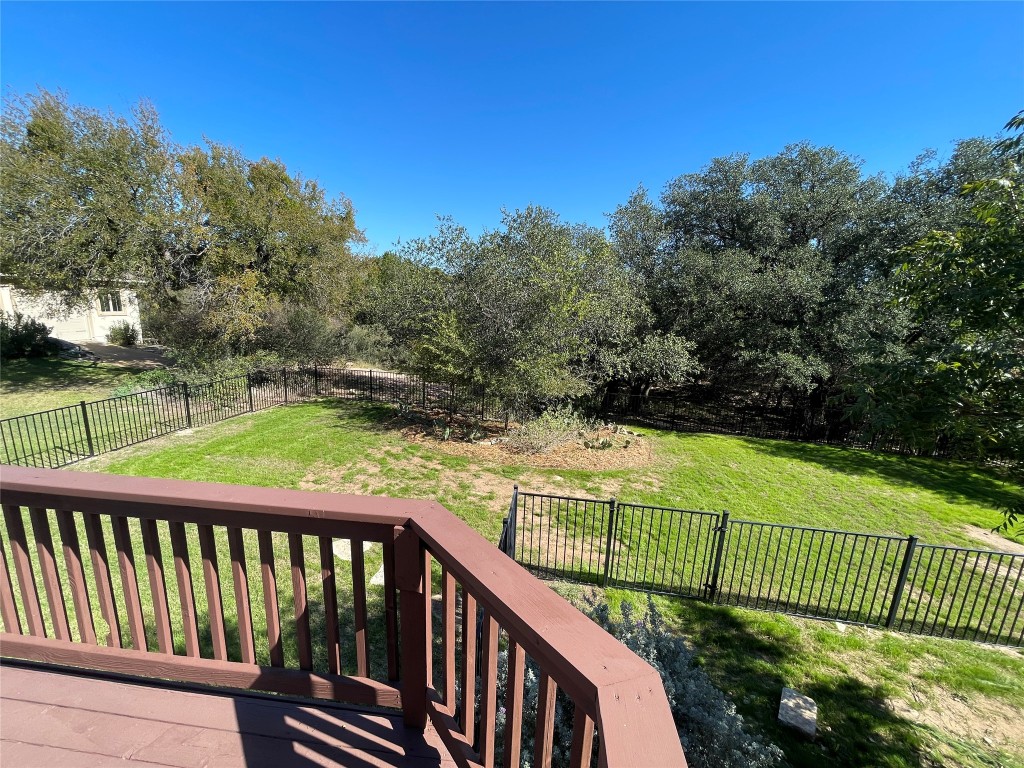 20603 Highland Lake Loop Lago Vista, TX 78645 - Photo 26 of 37 a view of a wooden deck and a garden