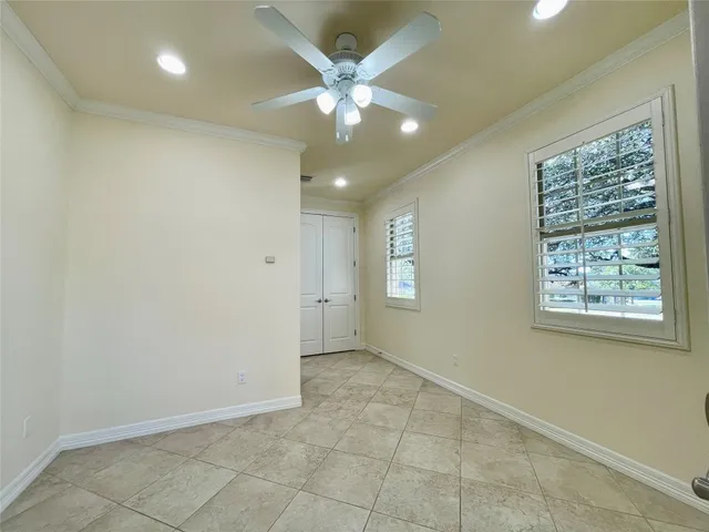 a bathroom with a sink mirror and toilet