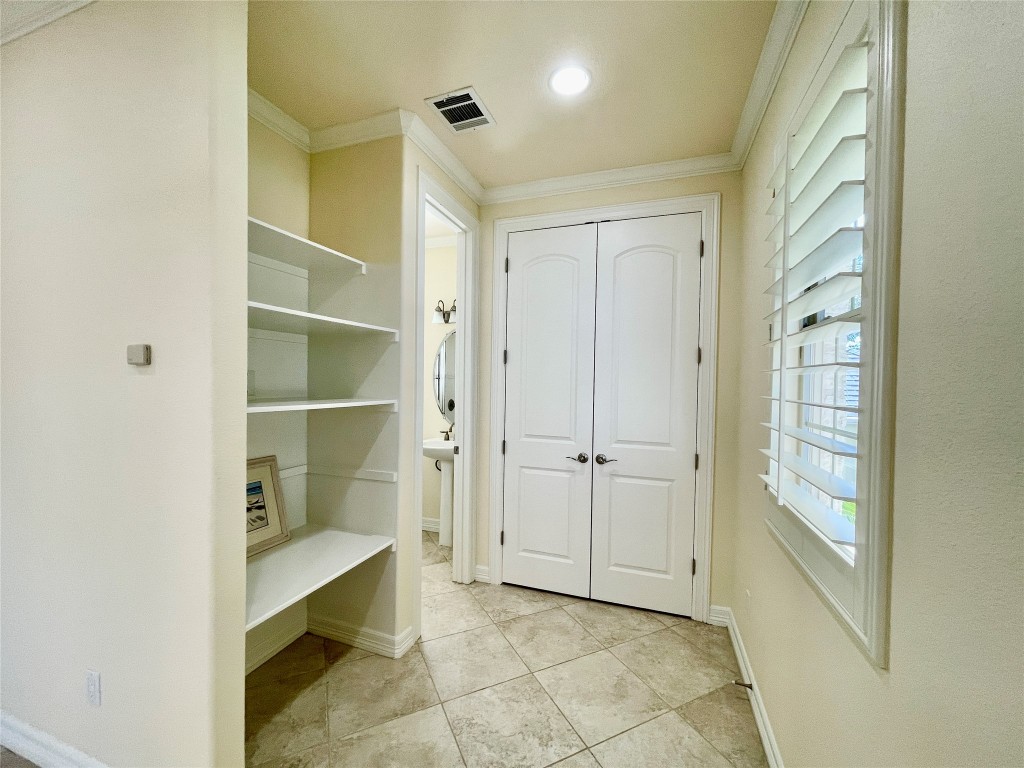 20603 Highland Lake Loop Lago Vista, TX 78645 - Photo 33 of 37 a view of a hallway with wooden shelves