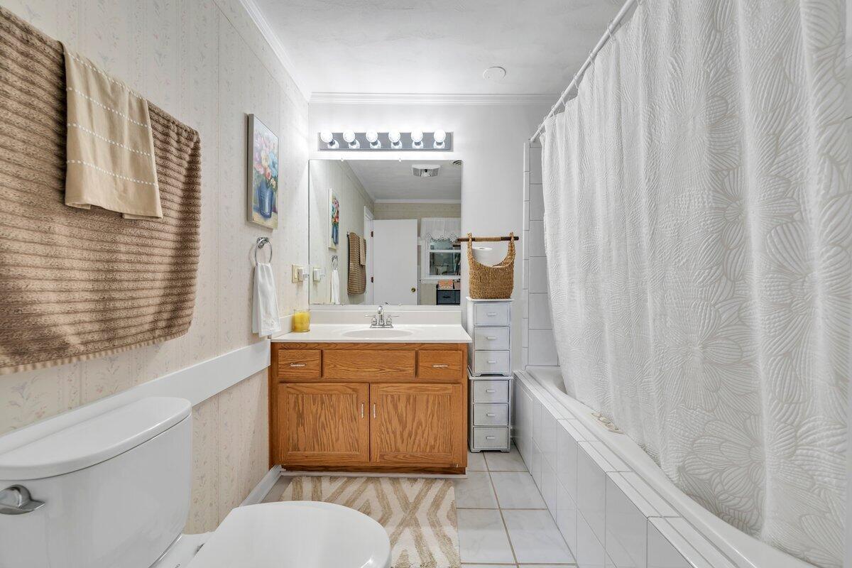 3226 Rakes Road Rocky Mount, VA 24151 - Photo 33 of 74 a bathroom with a granite countertop sink toilet and shower
