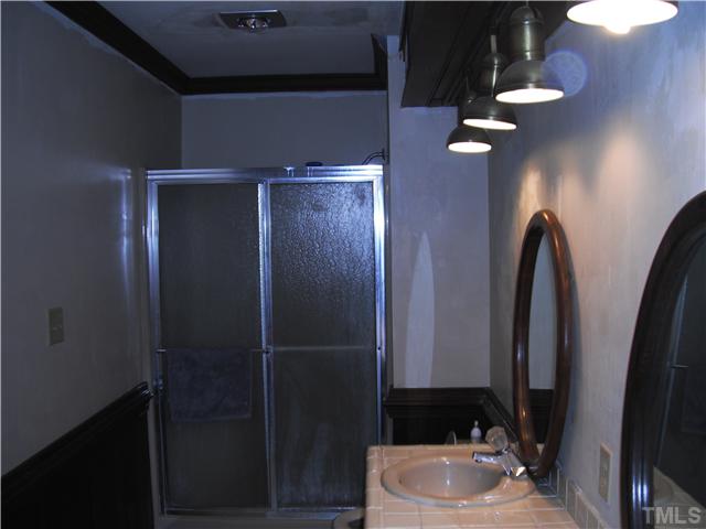 800 Ivanhoe Drive Raleigh, NC 27615 - Photo 11 of 19 a bathroom with a sink and a mirror