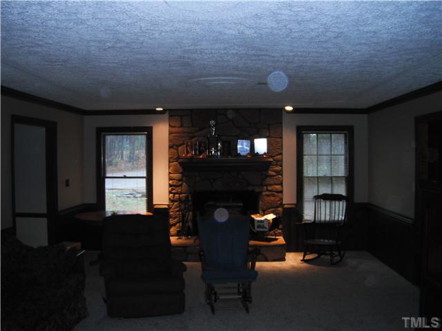 800 Ivanhoe Drive Raleigh, NC 27615 - Photo 13 of 19 a living room with furniture and a fireplace