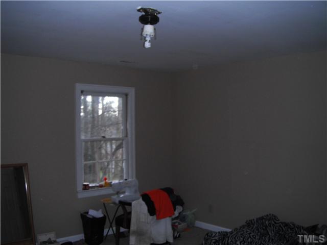 800 Ivanhoe Drive Raleigh, NC 27615 - Photo 16 of 19 a room with a table chair and a window