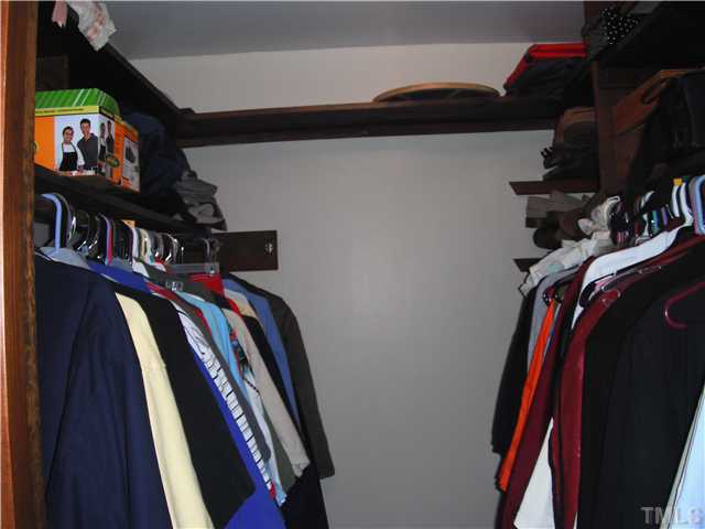 800 Ivanhoe Drive Raleigh, NC 27615 - Photo 10 of 19 a view of walk in closet with clothes and shoes