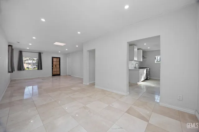 a view of a hallway with a bathroom