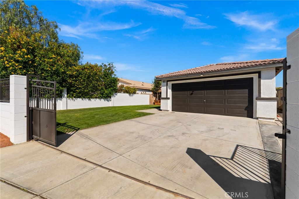 50855 Chiapas Drive Coachella, CA 92236 - Photo 11 of 34 a front view of a house with a yard