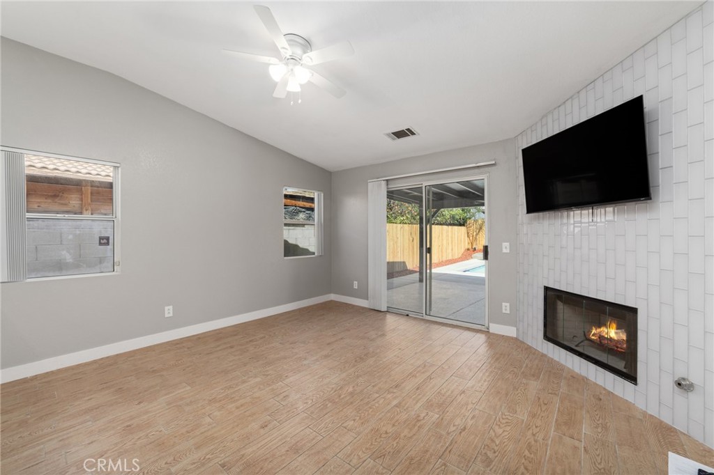 50855 Chiapas Drive Coachella, CA 92236 - Photo 13 of 34 a view of an empty room with a fireplace and a window