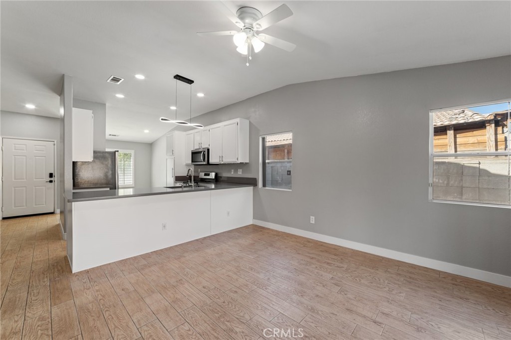50855 Chiapas Drive Coachella, CA 92236 - Photo 14 of 34 a view of kitchen with refrigerator cabinet and wooden floor