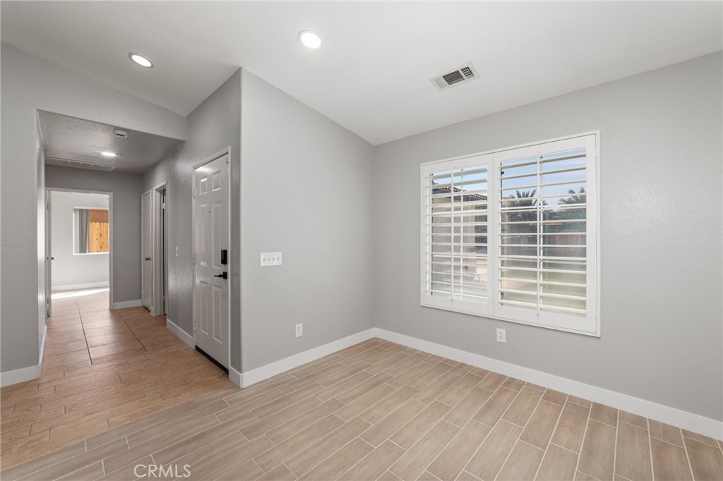 50855 Chiapas Drive Coachella, CA 92236 - Photo 15 of 34 a view of an empty room with wooden floor and a window
