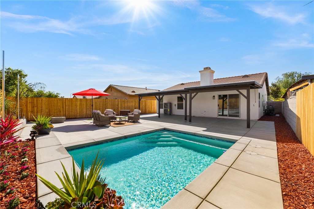 50855 Chiapas Drive Coachella, CA 92236 - Photo 2 of 34 a view of a house with backyard sitting area and swimming pool