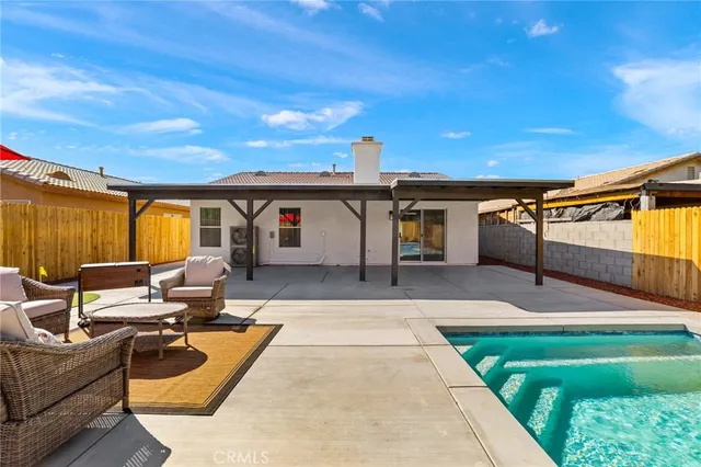 a balcony with furniture and a garden