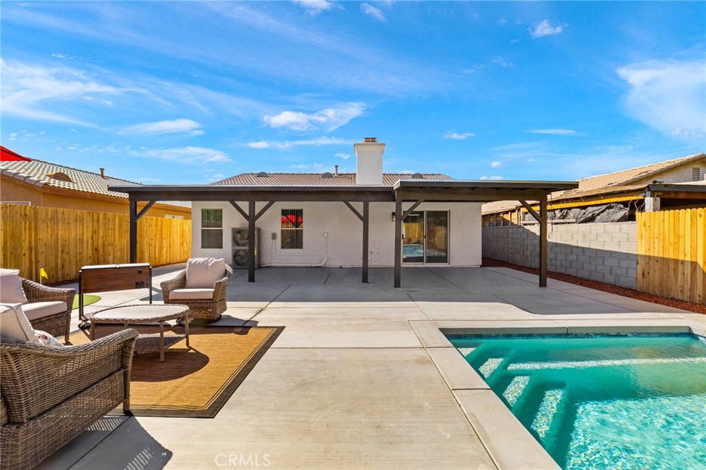 50855 Chiapas Drive Coachella, CA 92236 - Photo 3 of 34 a balcony with furniture and a garden