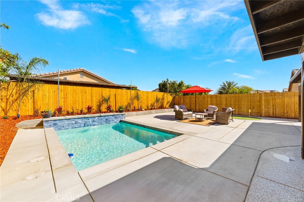 50855 Chiapas Drive Coachella, CA 92236 - Photo 4 of 34 a view of swimming pool with a lounge chairs
