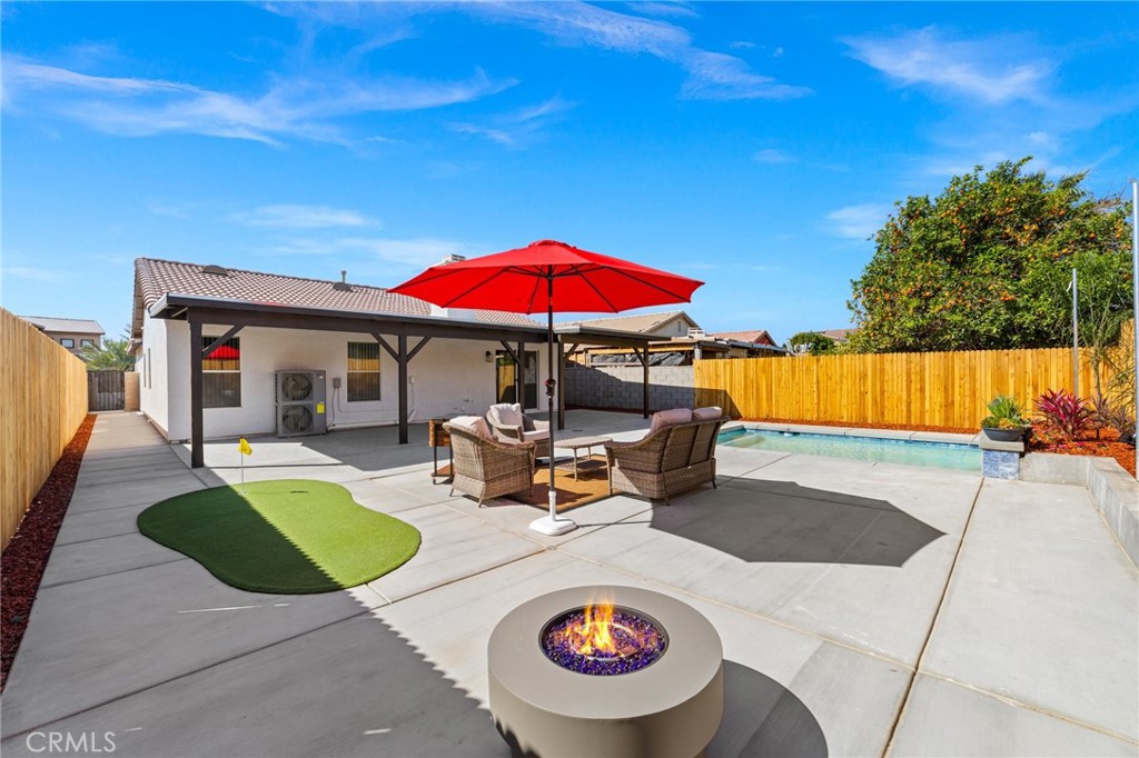 50855 Chiapas Drive Coachella, CA 92236 - Photo 5 of 34 a view of a swimming pool with a patio