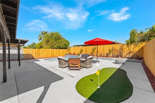 a view of a swimming pool with a patio