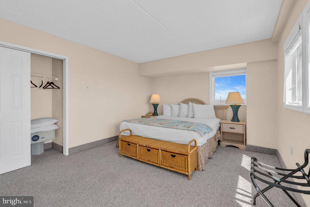 812 Ocean Avenue, Unit 420 Ocean City, NJ 08226 - Photo 15 of 20 a spacious bedroom with a bed and a window