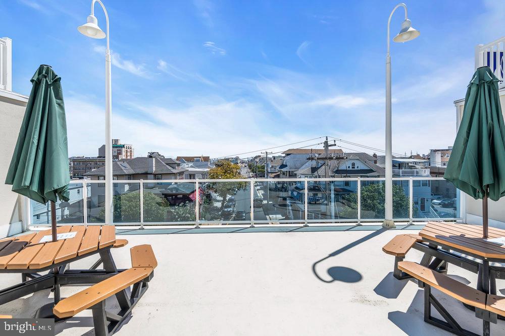 812 Ocean Avenue, Unit 420 Ocean City, NJ 08226 - Photo 18 of 20 a view of swimming pool with seating