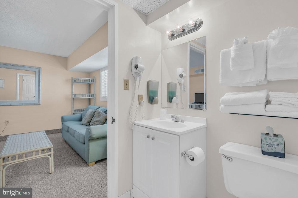 812 Ocean Avenue, Unit 420 Ocean City, NJ 08226 - Photo 10 of 20 a living room with furniture and a table