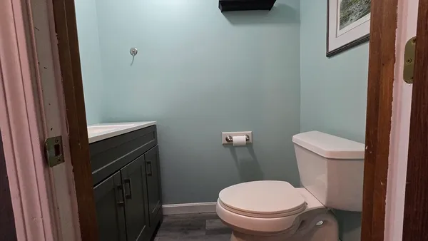 a bathroom with a toilet and a sink