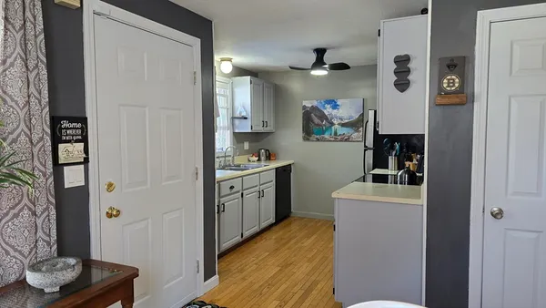 a kitchen with stainless steel appliances granite countertop a refrigerator and a stove