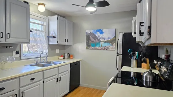 a kitchen with a sink and cabinets