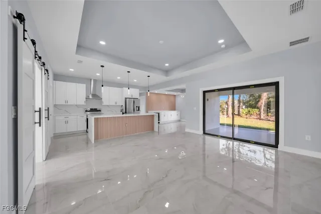 a view of a kitchen and a window