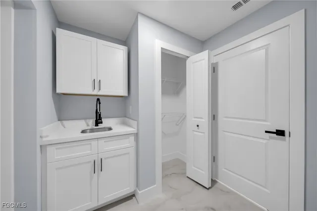 a bathroom with a sink toilet and vanity