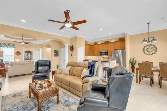 a dining room with furniture and a window