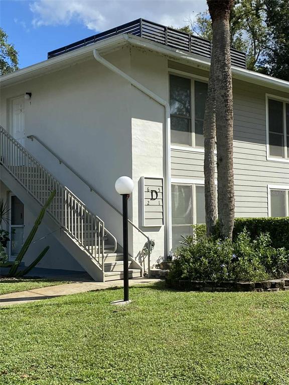 1935 South Conway Road, Unit D1 Orlando, FL 32812 - Photo 1 of 21 a house view with a garden space