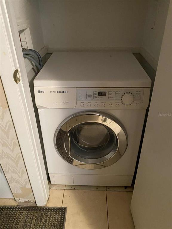 1935 South Conway Road, Unit D1 Orlando, FL 32812 - Photo 12 of 21 a utility room with dryer and washer