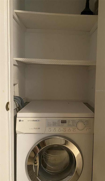 1935 South Conway Road, Unit D1 Orlando, FL 32812 - Photo 13 of 21 a utility room with washing machine