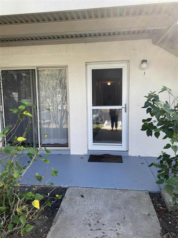 1935 South Conway Road, Unit D1 Orlando, FL 32812 - Photo 2 of 21 a front view of a house with garden