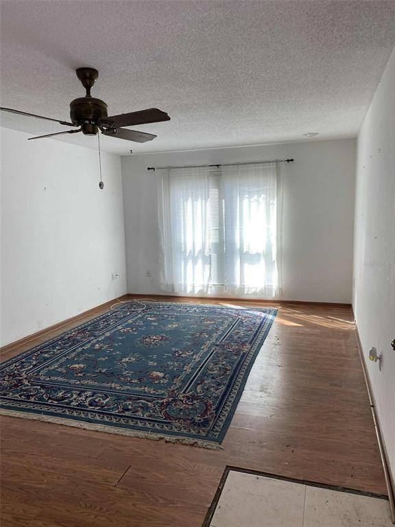 1935 South Conway Road, Unit D1 Orlando, FL 32812 - Photo 3 of 21 a view of empty room with wooden floor and window