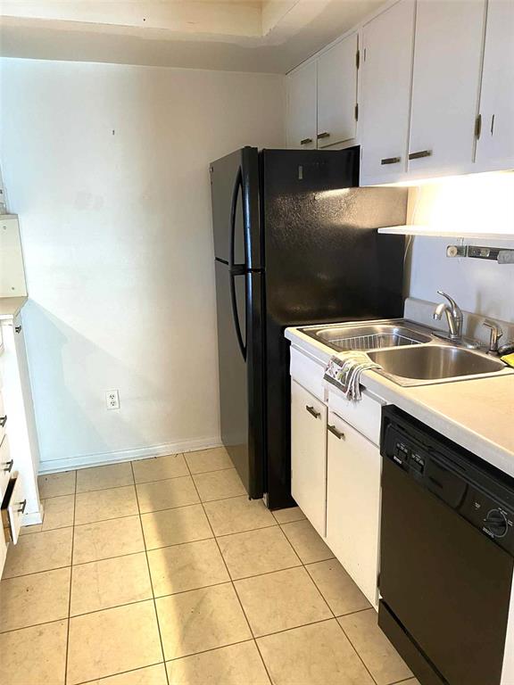 1935 South Conway Road, Unit D1 Orlando, FL 32812 - Photo 7 of 21 a kitchen with a sink a stove and refrigerator