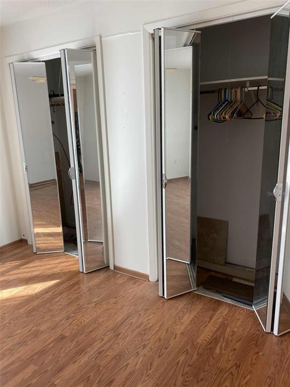 1935 South Conway Road, Unit D1 Orlando, FL 32812 - Photo 10 of 21 an empty room with wooden floor and a window
