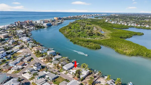 an aerial view of a house with a lake view
