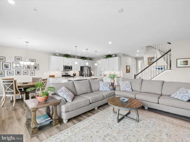 a spacious bathroom with a granite countertop sink mirror and a shower