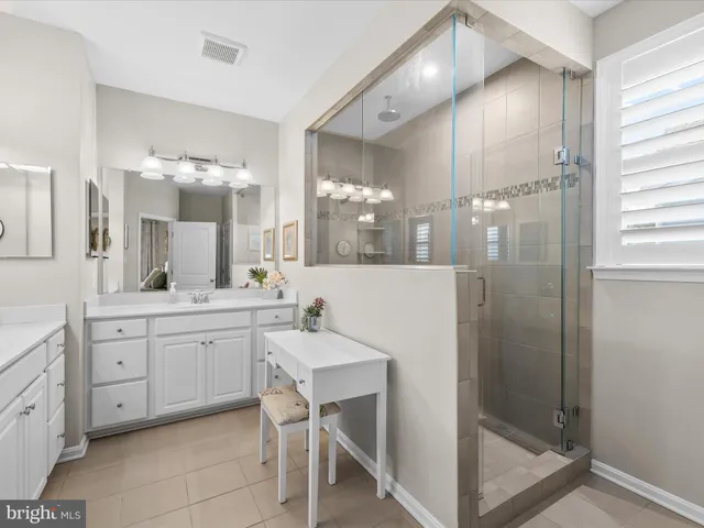 a view of a chair and tables in the balcony