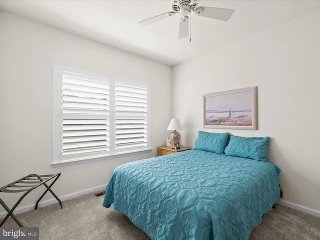 a view of a house with a yard and a porch