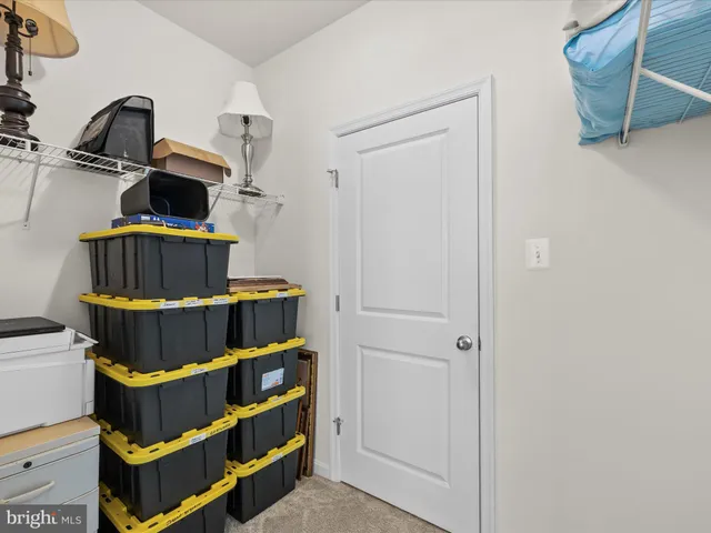an aerial view of a house with a garden and lake view