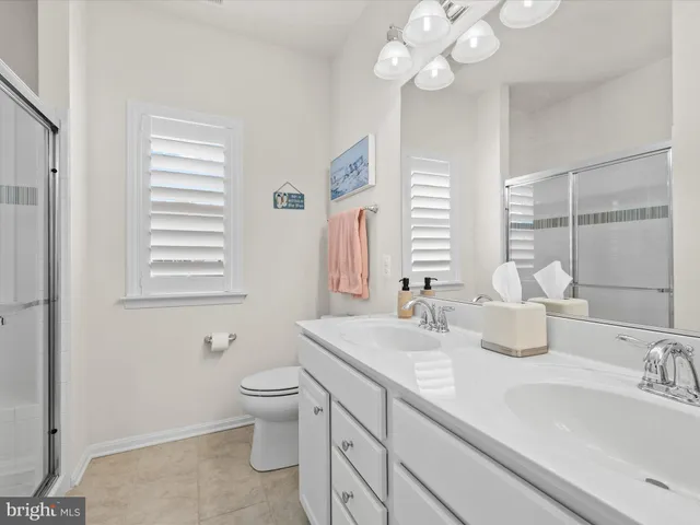 an aerial view of a house with swimming pool garden and outdoor seating