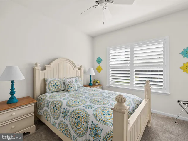 an aerial view of a house with a garden and swimming pool