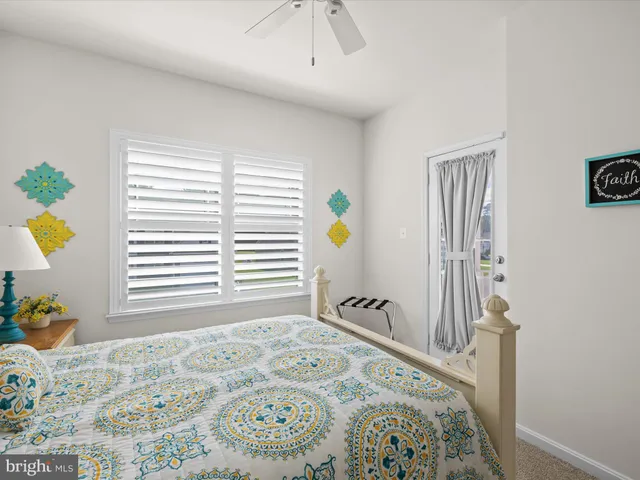 a view of a lake with a table and chairs