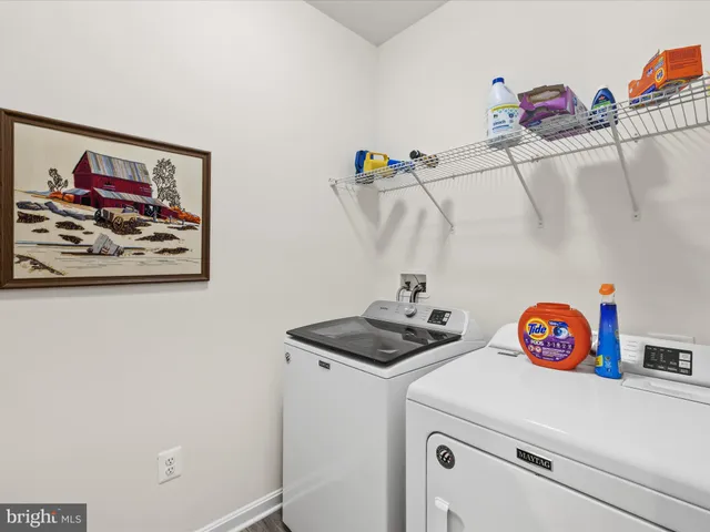 a view of a house with a big yard and large trees