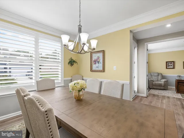 a kitchen with granite countertop sink stove and cabinets