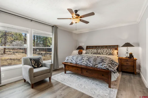 a spacious bathroom with a double vanity sink and a mirror