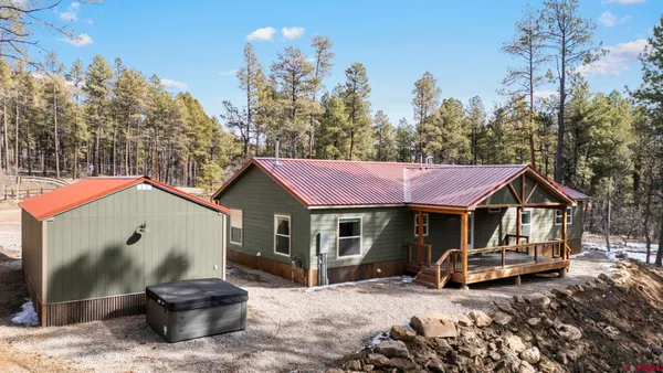a living room with furniture ceiling fan and a rug