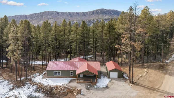 a view of outdoor space with wooden floor and windows