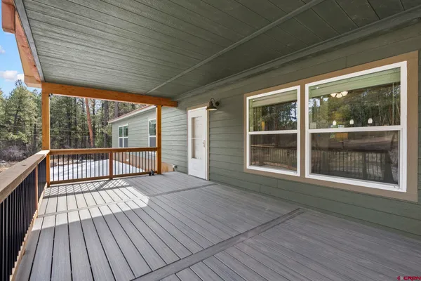 a view of a house with a yard and roof