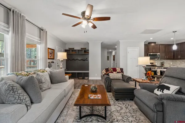 a kitchen with stainless steel appliances a sink stove and microwave